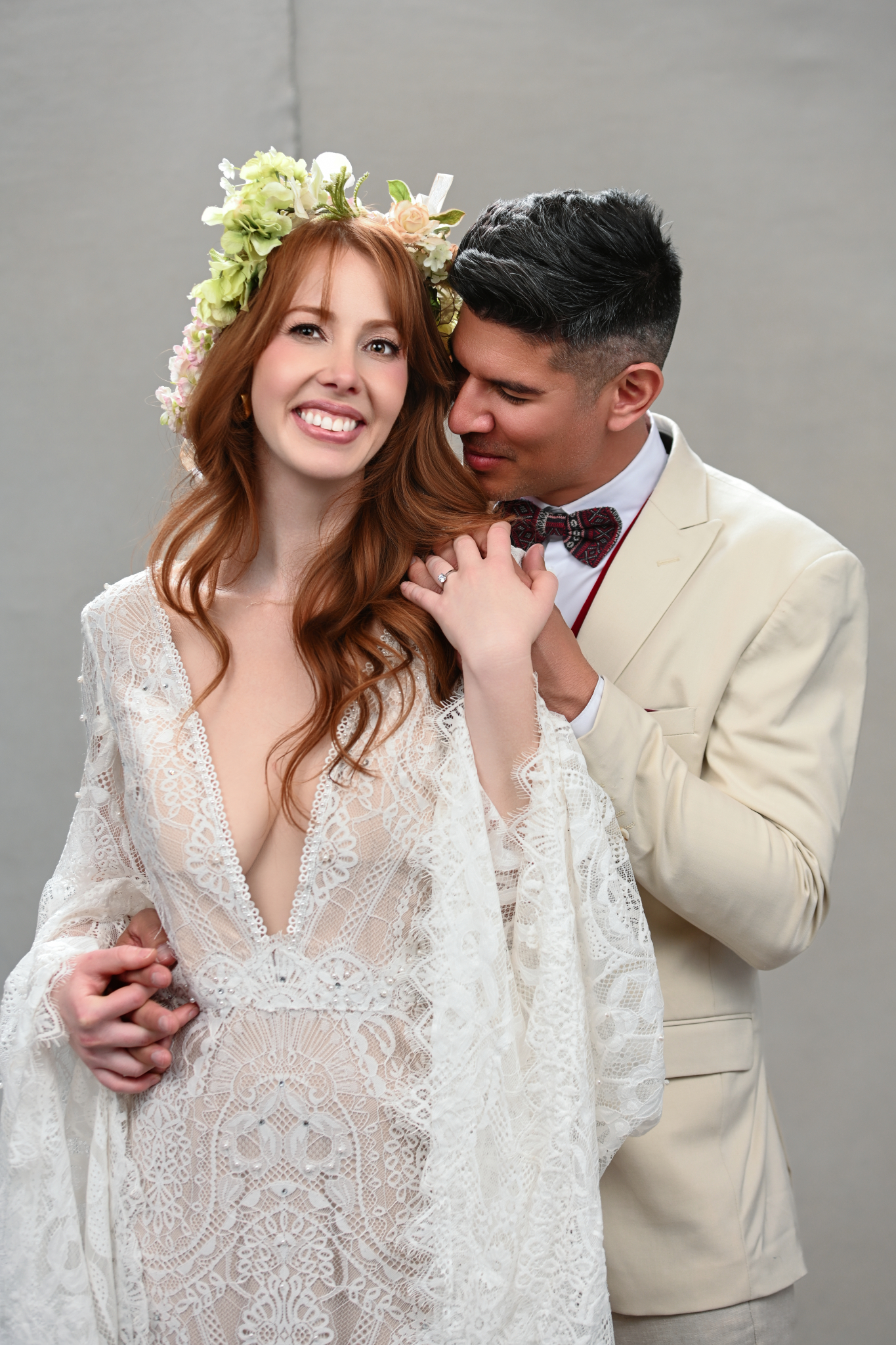 Full-bleed portrait frame beside the form — the couple, warm light